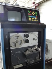 A punched tape reader on a CNC control - Shared through CC 3.0 by Wikipedia user Three Quarter Ten