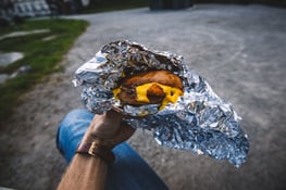 Burger wrapped in aluminum foil